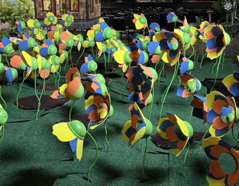 Concept art of the full Community Garden, flower beds in view